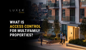 Modern multifamily apartment building with residents approaching a secure access-controlled entrance.