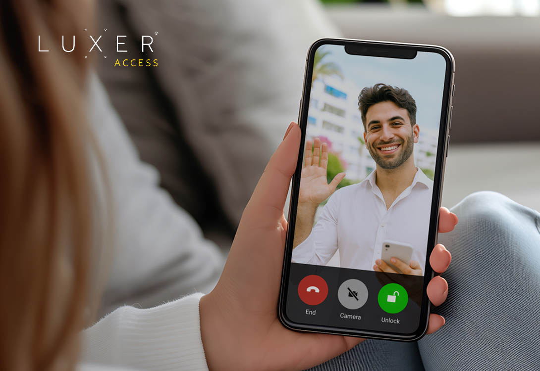 Resident using the Luxer Access mobile app to answer a video call from a visitor at the building’s entrance intercom.